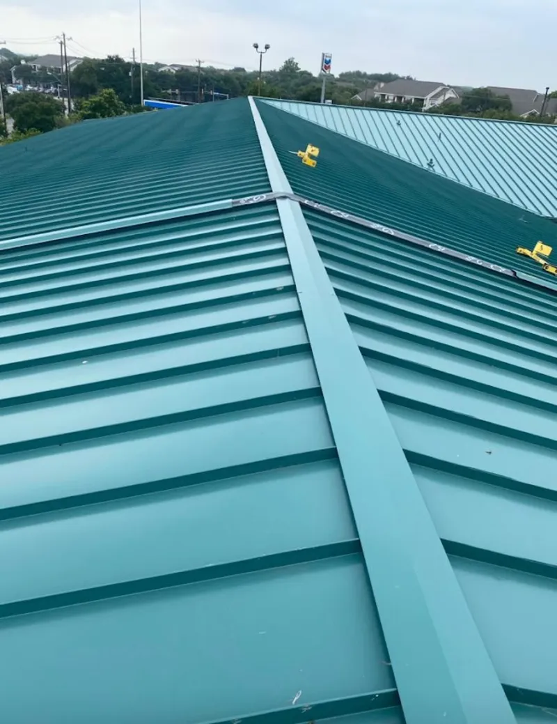 Green commercial metal roof ridge and valley for Metal Roof Repair in Mount Horeb